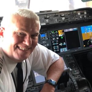 Kleck headshot photo of him in the plane