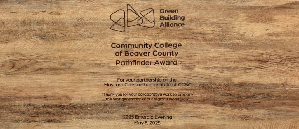 Wooden background of Green Building Alliance - Community College of Beaver County Pathfinder Award - For your parbership on the Mascaro Construction Institute at CCBC - Thank you for your collabortive work to prepare the next generation of our region's workforce - 2025 Emerald Evening May 8, 2025